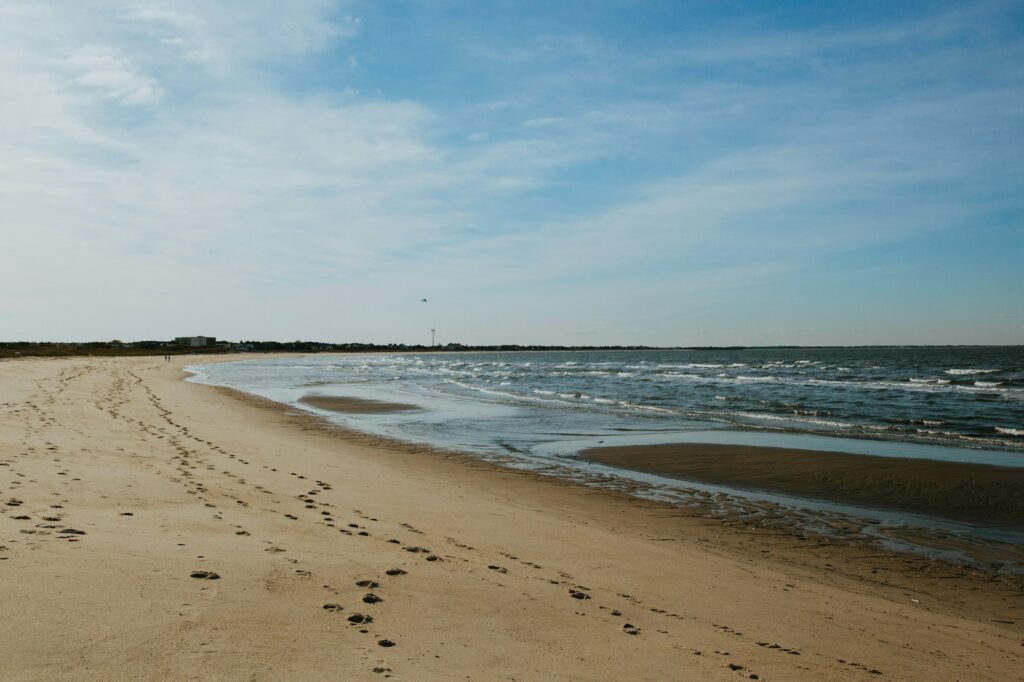 Footprints along the beach, symbolizing the journey and impact of Clear to Launch Dental Marketing' dental marketing in Newark, DE, guiding dental practices to success.