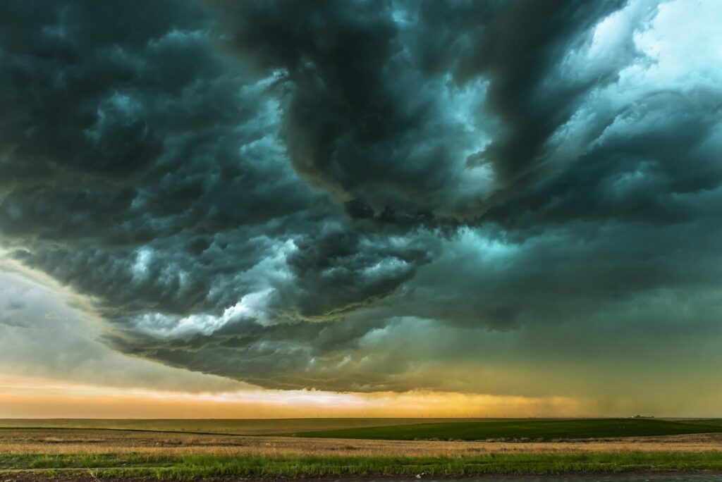 Storm clouds gathering over a field in Norman, Oklahoma, symbolizing the resilience and adaptability Clear to Launch Dental Marketing brings to dental marketing for Norman dental practices.